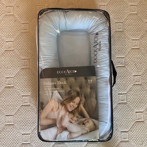 DockATot Deluxe+. Barely used this one (we had 2). Our baby loved the DockATot!